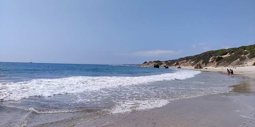 Picturesque view of Bolonia seashore with golden sand under clear blue sky - beaches in Seville