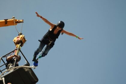 Snapshot of a woman bungee jumping from a platform–Bungee Jumping In Vizag