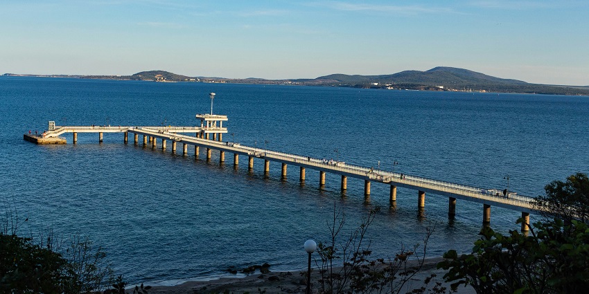 Picturesque Bulgaria, city Burgas, bridge in the sea with clear and clean blue water