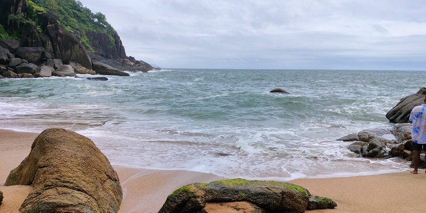 An Image of the rocky Butterfly beach, one of the most popular bikini beaches in India.