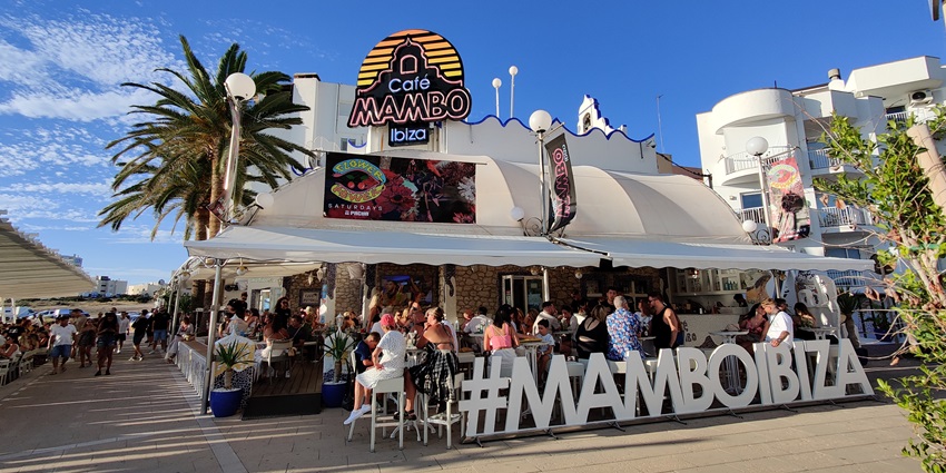 An image of people sitting, relaxing and enjoying delicacies at Café Mambo in Ibiza Spain