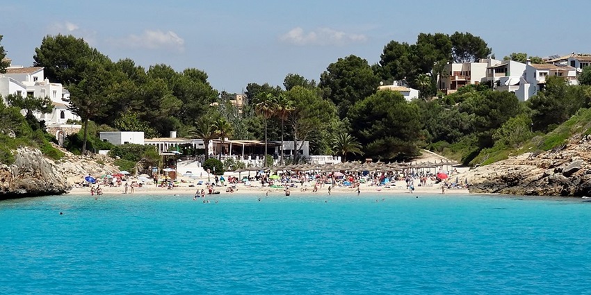 Escape to the tranquil shores of Cala Anguila which is a hidden gem in Spain.