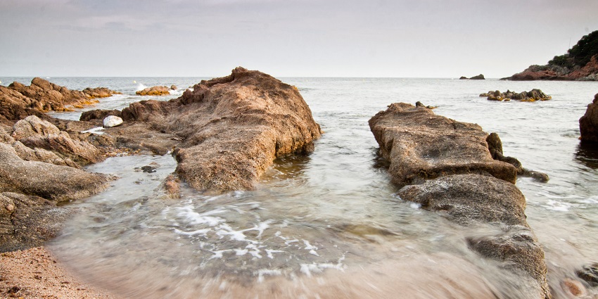 A glimpse of Cala Estreta Beach, nestled in the Costa Brava region of Catalonia.