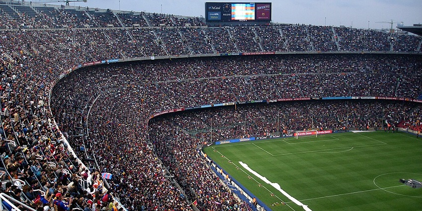 A crowd packed Camp Nou during an electrifying football match in Barcelona, Spain.