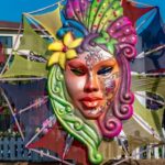 Beautiful and colourful Masquerade of a lady face, installed in the fields for the celebration of the annual Carnival in Goa.