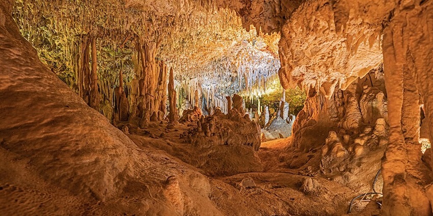 Discover the fishhook-shaped formations at Caves of Hams near Caves of Drach, Spain.