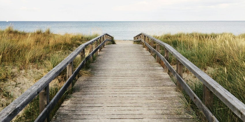 A lively coastal town with a historic pier, great surfing, and fresh seafood.