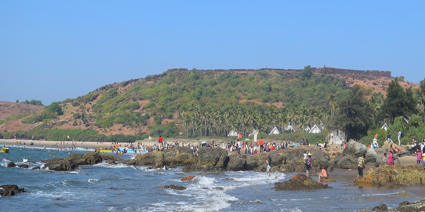 A distant view of Chapora Fort from a crowded Vagator Beach in Northern Goa.