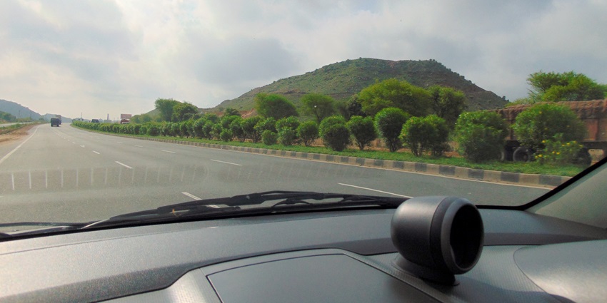 An image of a winding road through the hills with a mountain in the background, showing the route.