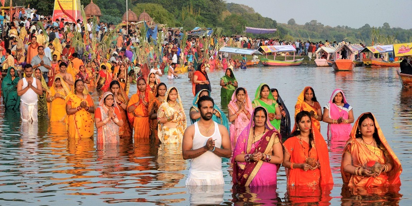Witness devotion at sunrise during the vibrant and sacred Chhath Puja celebrations.