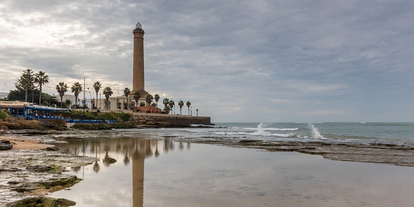 High lighthouse of Chipiona near beach, located in Chipiona, province of Cádiz, Andalusia
