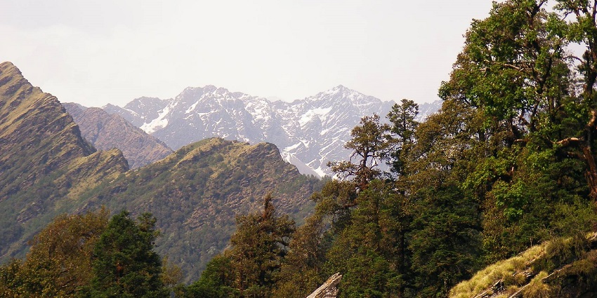 Vast mountain range of Chopta with some snow-capped peaks visible in the distance