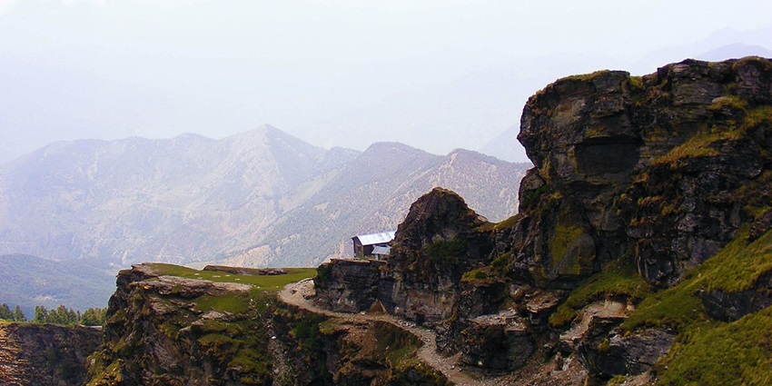 An image showing a view from the Chandrashila Trek, a popular high-altitude trek in Uttarakhand.
