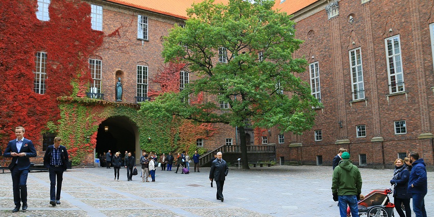 An image showing the courtyard of Stockholm City Hall, featuring its elegant architecture.