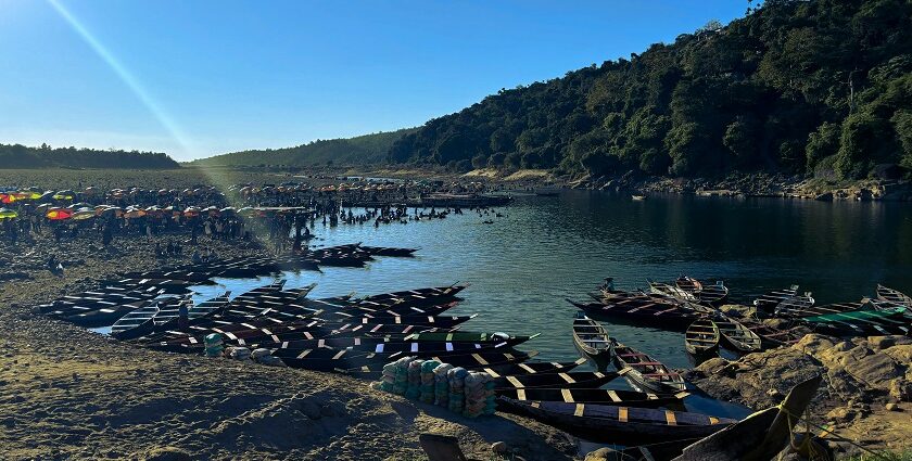 A picture of the cleanest lake in Meghalaya, with crystal-clear waters reflecting the lush greenery around it.