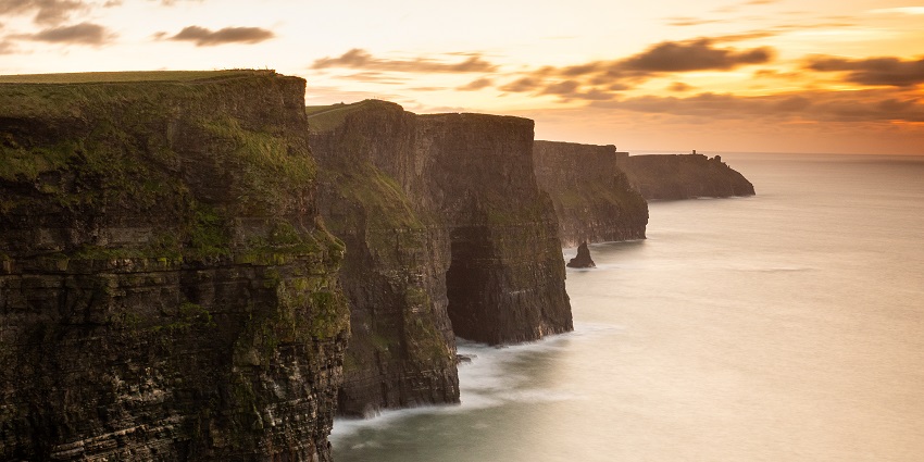 An image showing the Cliffs of Moher at sunset, the best place for Valentine's Day in Ireland.