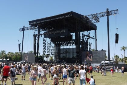 An image of a vibrant scene of the Coachella Music Festival, with a crowd enjoying live performances