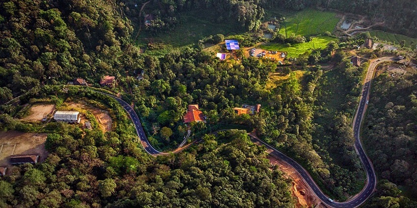 An image of an Aerial view of hairpin bends in Coorg, one of the places to visit in October with family in India.
