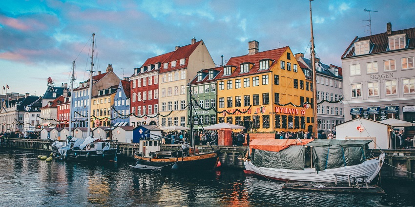 An Image of boats floating in a canal in Copenhagen, one of Denmark's best places to visit