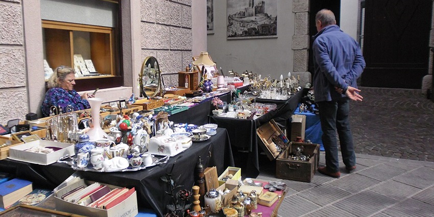 A view of shopping in Milan, Italy at Cormano Flea Market for household items.