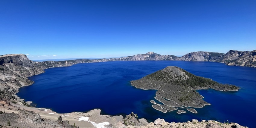 A picturesque image of blue waters at the Crater Lake in South-Central Oregon, USA.