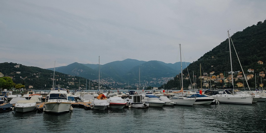 Numerous boats docked near the shores , one of the best things to do at Lake Como.