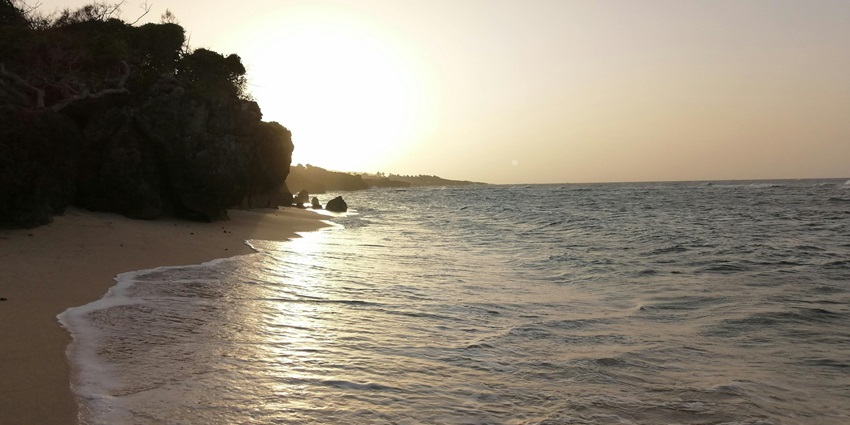 one of the best serene beaches in Saint Martin surrounded by cliffs, offering stunning views and crystal-clear waters.
