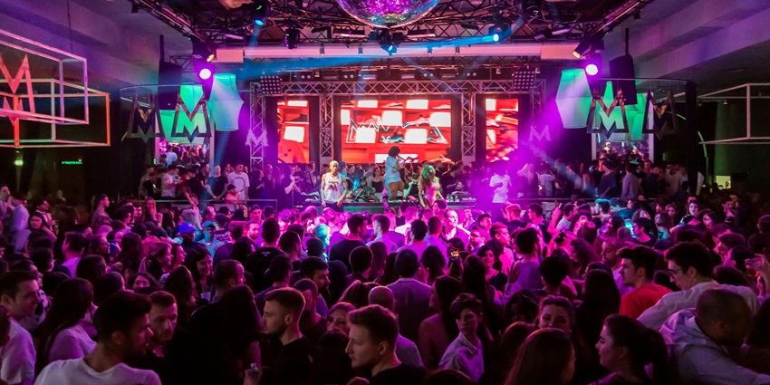 An image showing a concert, dance club, and disco resembling the vibrant Debaser Strand.