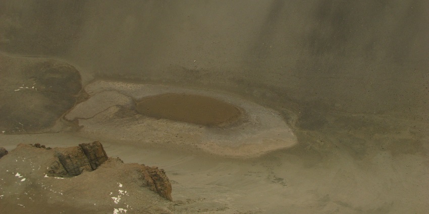 Frozen Don Juan pond from above in Mcmurdo dry valley, surrounded by dry sandy hills