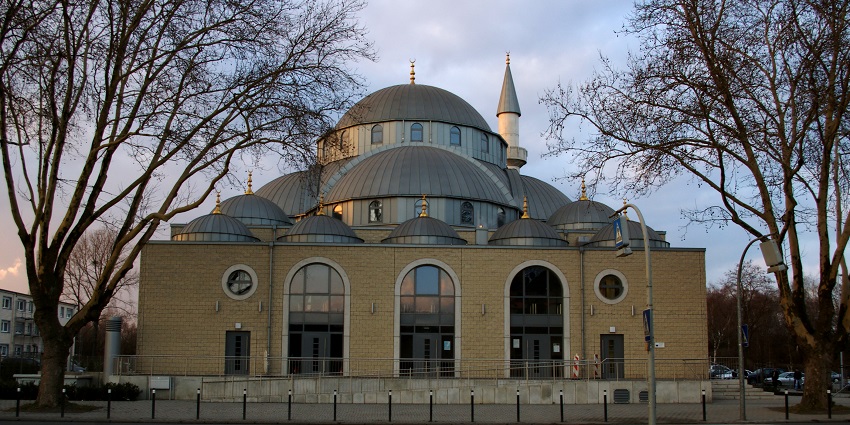An image of Duisburg Central Mosque with its grand façade and intricate design