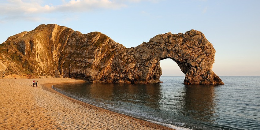 Durdle Door Beach is a breathtaking limestone arch with crystal-clear turquoise waters.