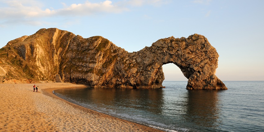 A beach with a natural limestone arch, making it one of the beautiful beaches in UK.