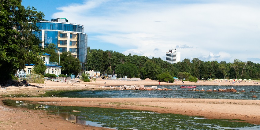 A calm beach offering crystal-clear waters and scenic surroundings.