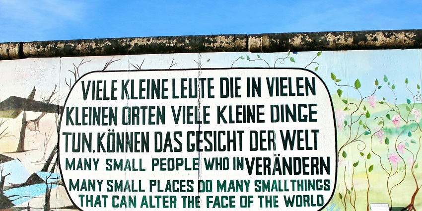 An Image of graffiti painted on the East Side Gallery, longest open-air gallery in Berlin.