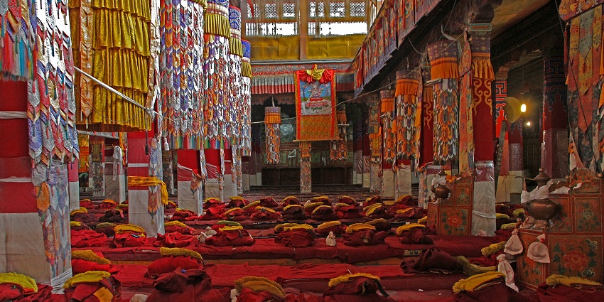Monks involved in deep introspection in Drepung Monastery.