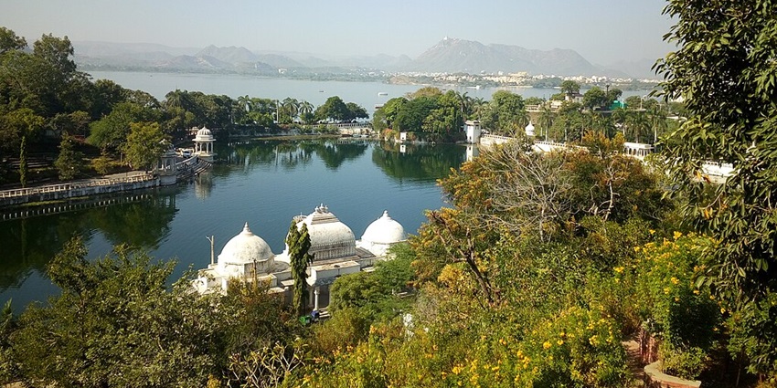 The aerial view of Dudh Talai, surrounded by lush greenery, palaces and distant mountains