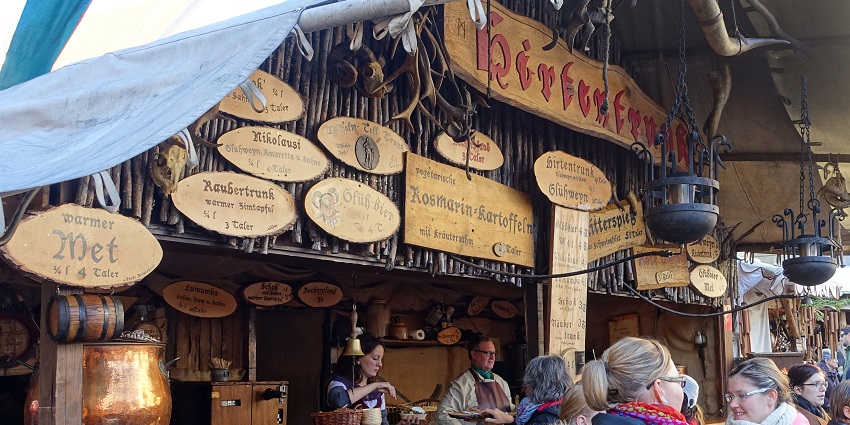 An image of the Stuttgart Christmas Market with festive decorations and lively stalls.