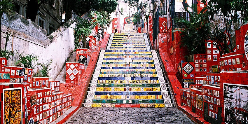 Vibrant staircase adorned with colourful tiles by artist Jorge Selarón, highlighted among places to visit in Rio.