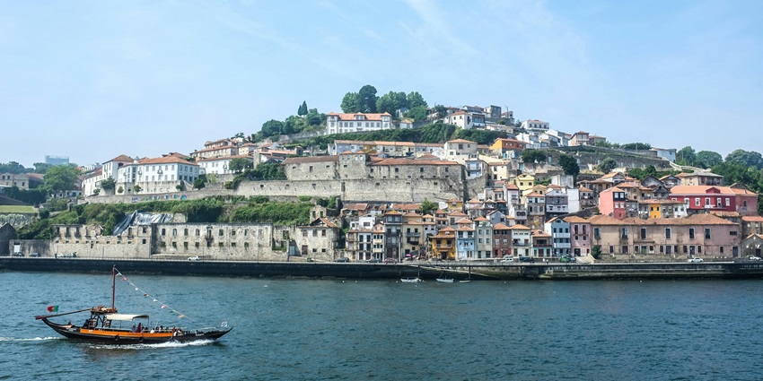 Enjoying port wine tasting with stunning views of Porto from Vila Nova de Gaia.
