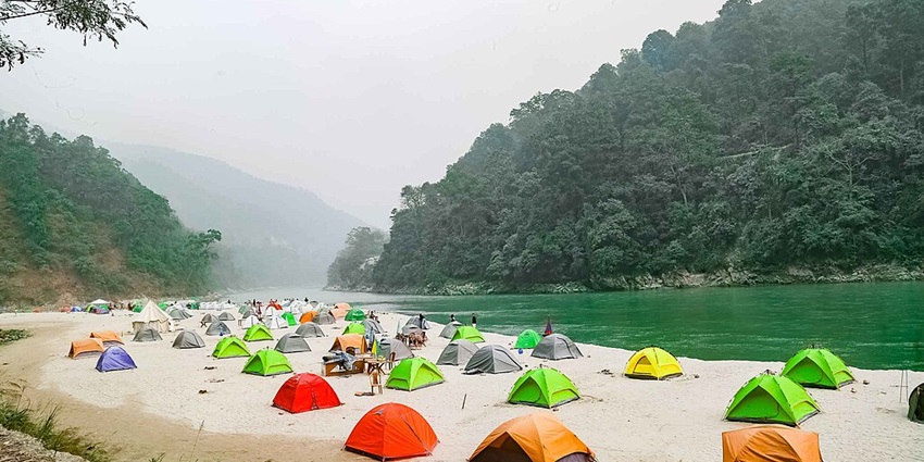 Rainbow of tents with an amazing view - one of the things to do at Damadama Lake.