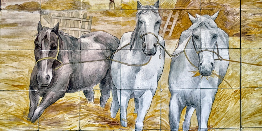 Azulejo art depicting three horses in a field, on display at the National Tile Museum