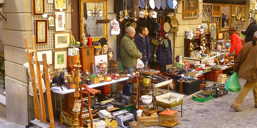Discover unique finds at El Rastro, Madrid's iconic flea market,one of the best things to do in Madrid in November!