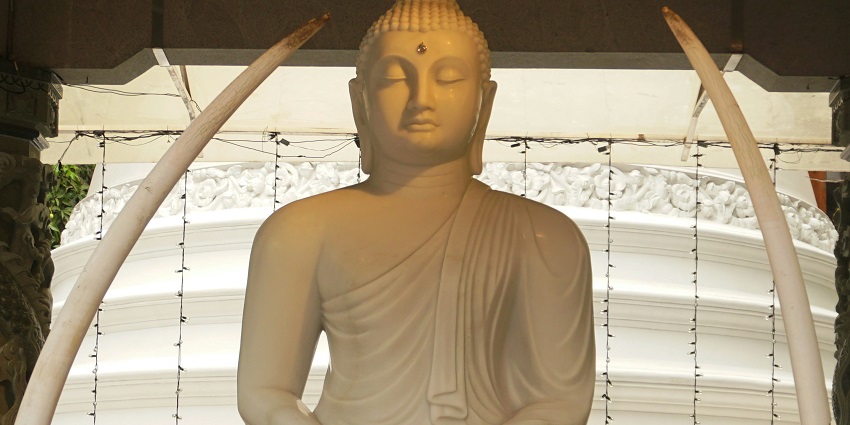 Gangaramaya Temple, a buddhist temple with intricate architecture and sculptures.