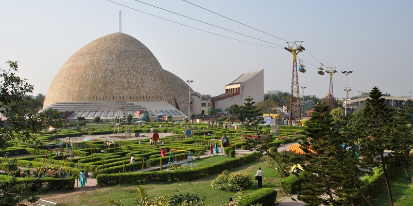 The exterior view of a state-of-the-art dome and paths through a well-managed garden