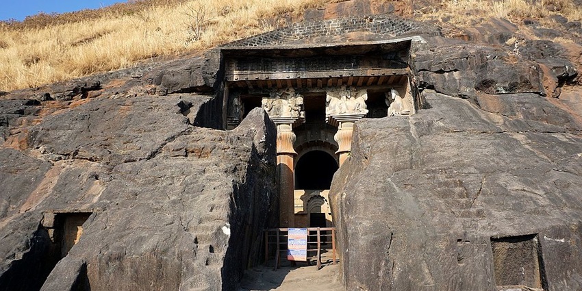 A closed entrance of the Chaitya Hall carved out of rock in Bedsa Caves near the lake.