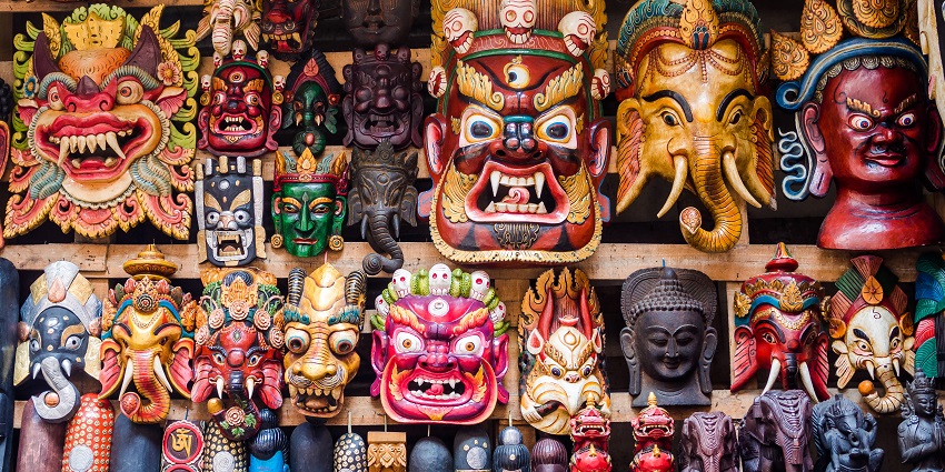 Colorful wooden masks and handicrafts on sale at shop during the Losar Festival