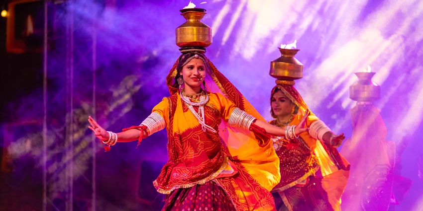 A group of females artist performing ghoomar folk dance during Taj Mahotsav Agra.
