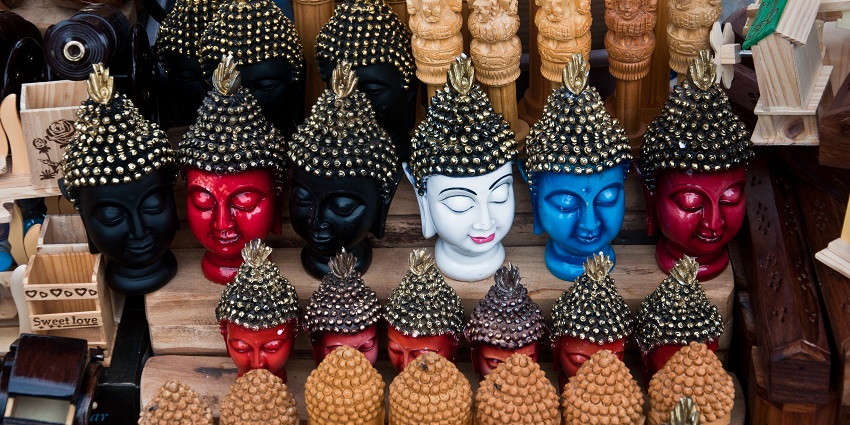 Buddha in different moods at Chamundi Hills market in Karnataka