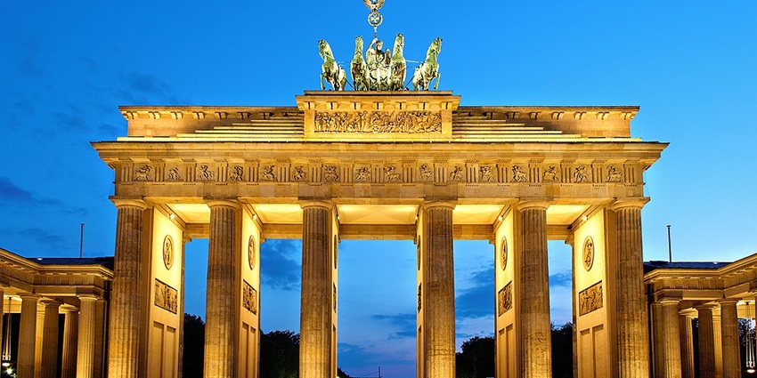 An image showing Brandenburger Tor beautifully lit at night, among iconic things to see in Berlin