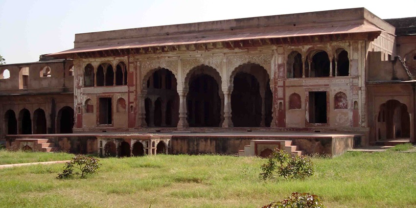 A glimpse of the magnificent Sheesh Mahal in Farrukhnagar surrounded by lush greenery.